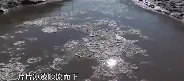 壶口瀑布奇观：冬日流凌现彩虹与冰瀑奇景